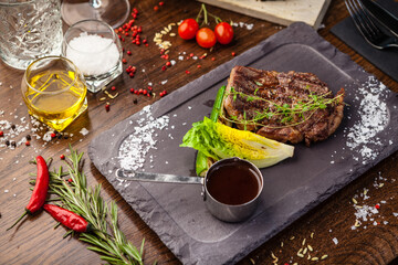 Black Angus Entrecote steak. Marbled steak from Uruguay. Delicious healthy traditional food closeup served for lunch in modern gourmet cuisine restaurant
