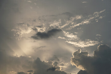 Fototapeta na wymiar overcast sky with sunshine in the backdrop
