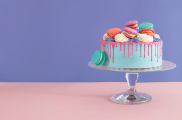 piece of cake with pink and blue decor on color background