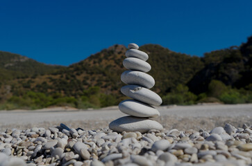 Zen stones on the shore amid mountains in Turkey