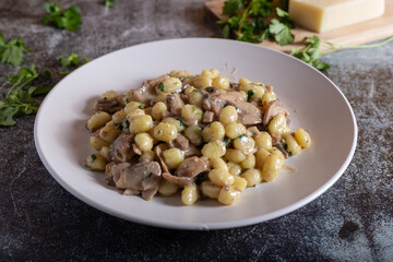 Creamy porcini mushroom gnocchi. Typical dish of Italian cuisine, suitable for a vegetarian diet