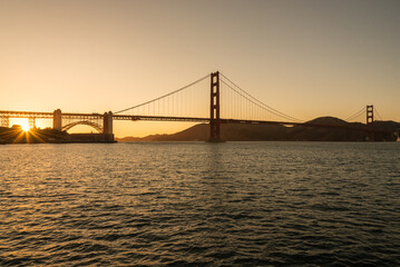 Fototapeta na wymiar Sunset. The Golden gate bridge during the golden hour