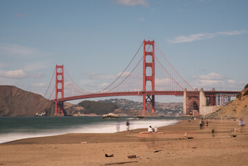 Fototapeta na wymiar long exposure ghosting on the beach by the Golden Gate bridge