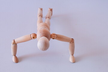 Wooden figure as a model for exercising at home