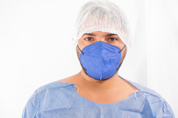 Portrait of tired exhausted nurse or doctor having a coffee break outside in the morning. COVID-19, Coronavirus pandemic