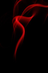 Obraz premium Abstract red smoke moving on black background.