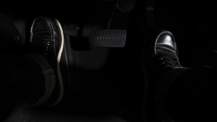 Accelerate and Brake. Foot pressing foot pedal of a car to drive ahead. Accelerator and brake pedal...