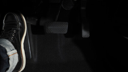 Accelerate and Brake. Foot pressing foot pedal of a car to drive ahead. Accelerator and brake pedal...