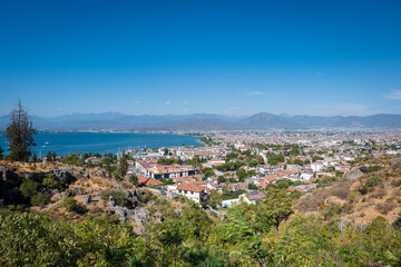 Fototapeta na wymiar Fethiye landscape and cityscape, aerial view of the popular resort city of Fethiye and the Bay of the Mediterranean sea, Turkey.