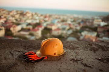 Yellow hard safety wear helmet hat in the project  at construction site
