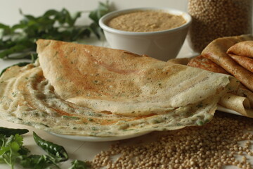 Jowar Dosa. A savoury crepe made of jowar flour. Golden crispy and crunchy dosa made with jowar...