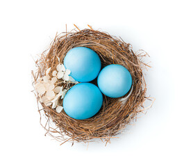 Naklejka na ściany i meble The nest with Easter pink eggs is isolated on a white background.