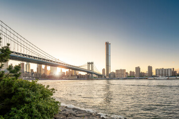 View of Manhattan Bridge and East River at sunset - Manhattan, NYC, USA
