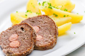 homemade meat loaf filled with sausage