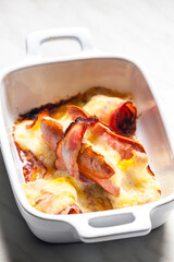wurst in bacon baked with chedar cheese