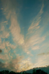 Feather clouds in the shape of an angel are visible in the sky. The photo was taken on the day of the Archangel Michael