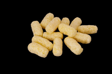 pile of corn sticks isolated on black background