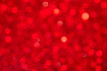 Red bokeh from many round highlights. Background. Texture.