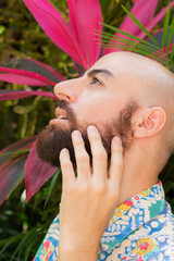 Obraz premium bearded man touching his face and looking up