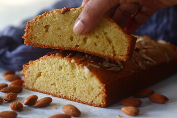 Ghee cake slice. Vanilla flavoured ghee cake with almonds on top. The perfect accompaniment for a cup of coffee.