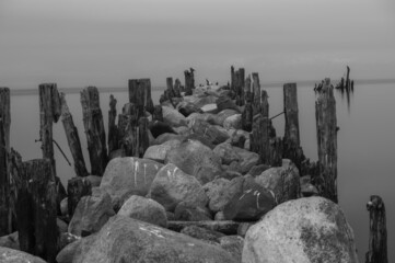an old pier made of stones and wood