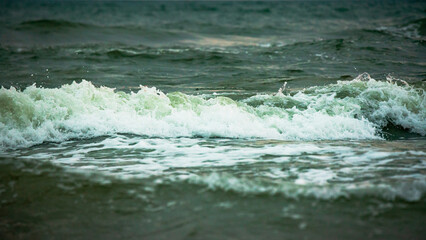 waves in the sea with white foam