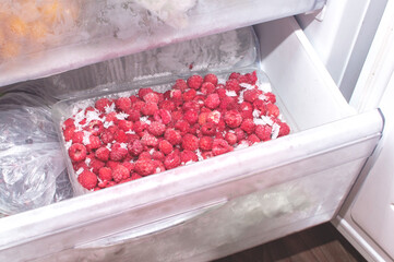 Frozen raspberries are stored in the Bottom Freezer Drawer. Deep freezing of berries and vegetables to preserve their beneficial properties
