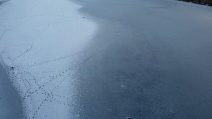 aerial view of the surface of a frozen lake