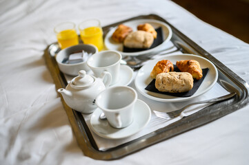 Continental breakfast coffee milk orange juice and croissant