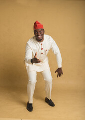 Yoruba Culturally Dressed Business Man Dancing and Smiling