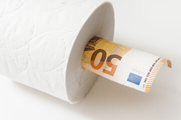 Fifty euro banknote put inside a toilet paper roll.