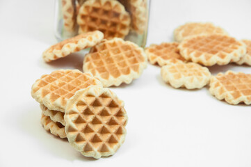 Belgian waffles on a table. holiday cookies on a white background. fresh baking concept. sweet desserts on a light texture