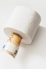 Fifty euro banknote put inside a toilet paper roll.