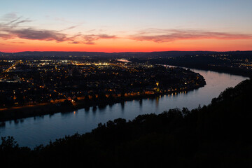 Koblenz am Rhein after sunset. The city lights are on.