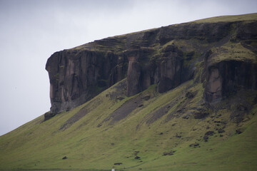 Green Grassy mountain Landscape in the highlands. Travel and nature on a beautiful cold day