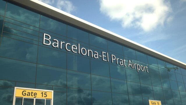 Taking off airplane reflecting in the modern windows with Barcelona-El Prat Airport text