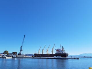 ship crane in the port of preveza greece in sunny calm day wating for loading
