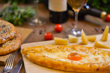 Dishes of Georgian cuisine: Adjarian khachapuri with cheese.