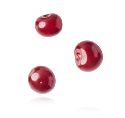 Fresh raw cheery falling in the air on white background.