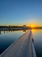 Fototapeta premium pier at sunrise in the port of Flensburg, Schleswig Holstein, Northern Germany