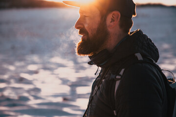 caucasuan man portrait in winter sunset nature and outdoors