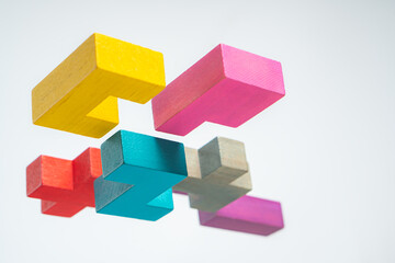 Obraz premium Abstract construction from wooden blocks. The concept of logical thinking..