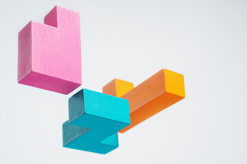 Obraz premium Abstract construction from wooden blocks. The concept of logical thinking..