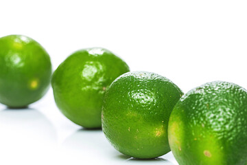 Fresh green lime fruits on white background