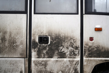 Dirty bus doors with traces of people touching
