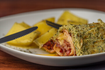 Courgette roll with ham and bacon and cheese with potatoes