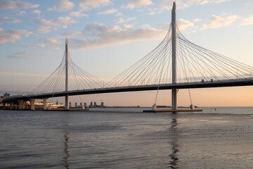 Cable-stayed bridge of the western high-speed diameter in the soft color of a sunset. Saint Petersburg.