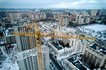 Construction crane on the background of the construction site.