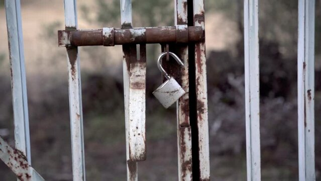 Opened lock on a metal gate