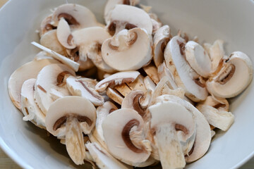 button mushrooms sliced and ready for cooking, food preparation  